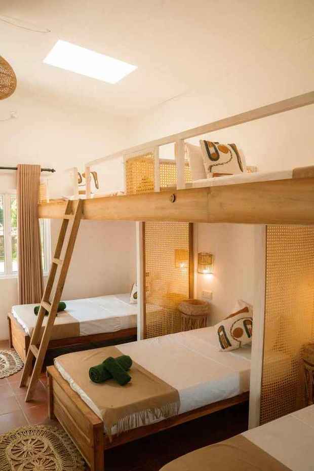 Female dorm — bunks with cane privacy screens