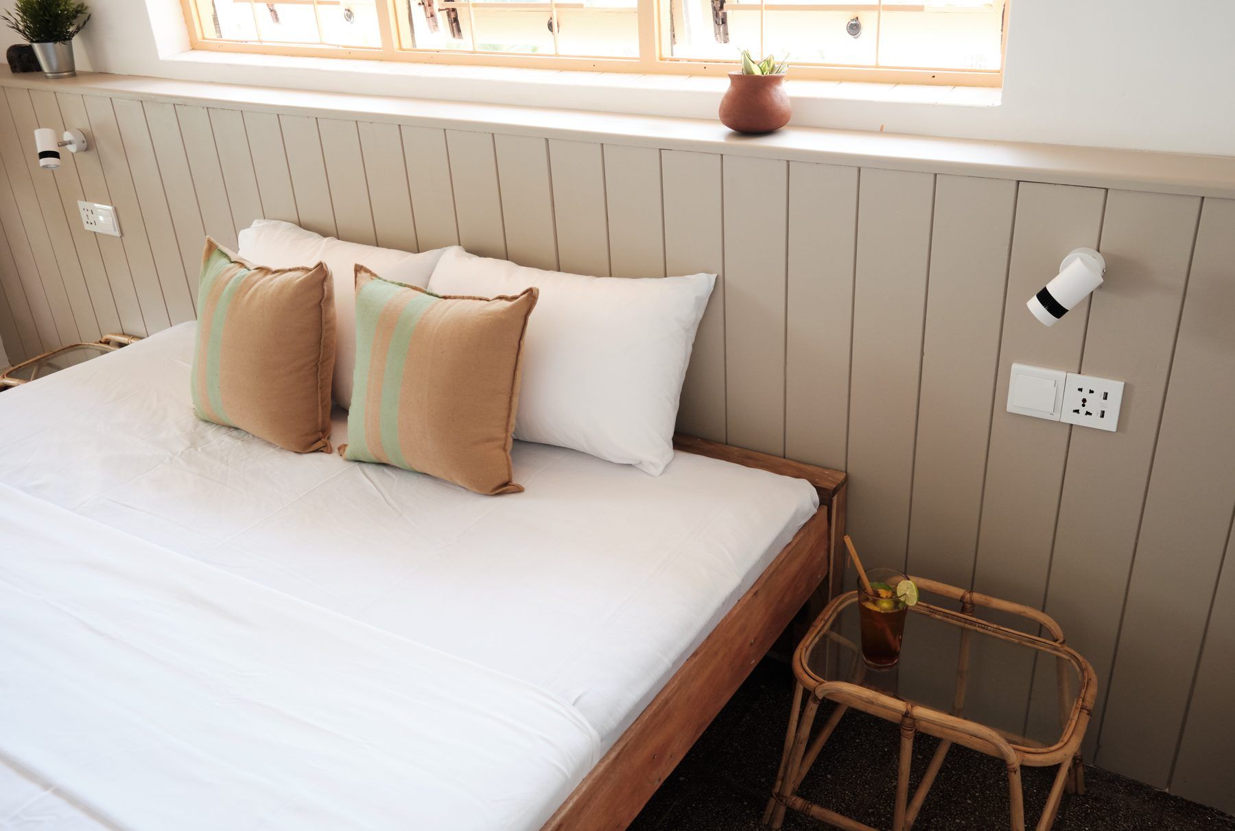 Queen bed and rattan bedside table
