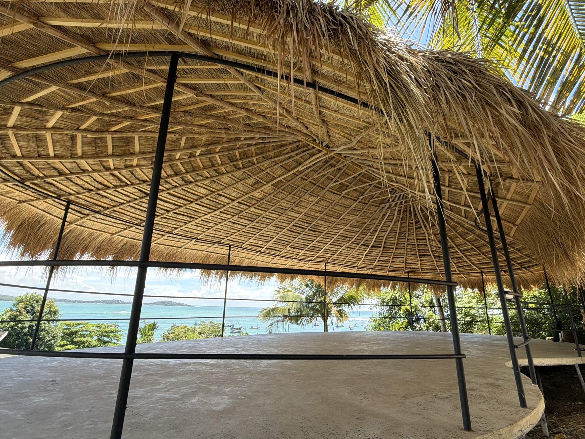 Inside the new shala, thatched roof and open sides